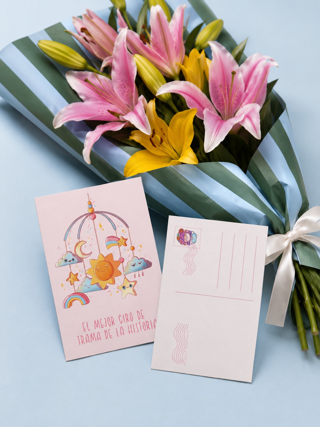 Lizy Del Busto illustrated A6 postcards displayed beside a bouquet of flowers